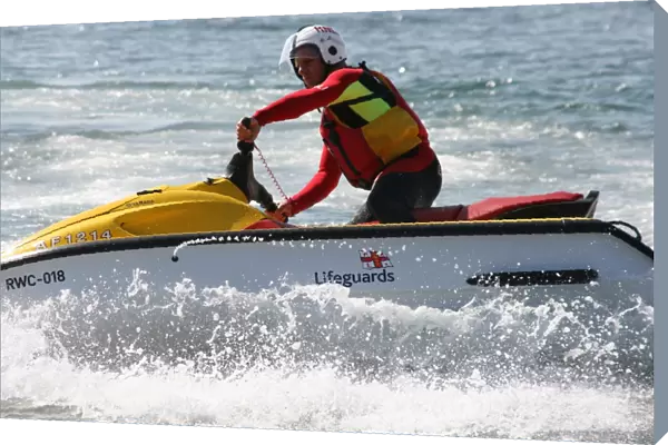 An RNLI lifeguard on a rescue water craft
