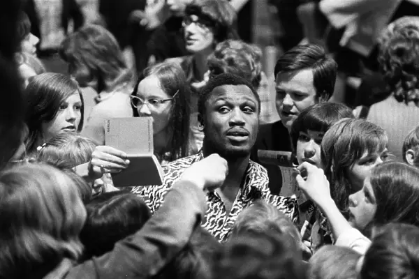 + Heavyweight boxer Joe Frazier of USA during an Autograph session in Berlin in 1971