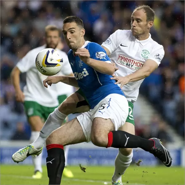 Rangers vs Hibernian: A Fight for the Petrofac Training Cup - Ibrox Stadium: Wallace vs Gray's Intense Battle for Possession (Scottish Cup, 2003)