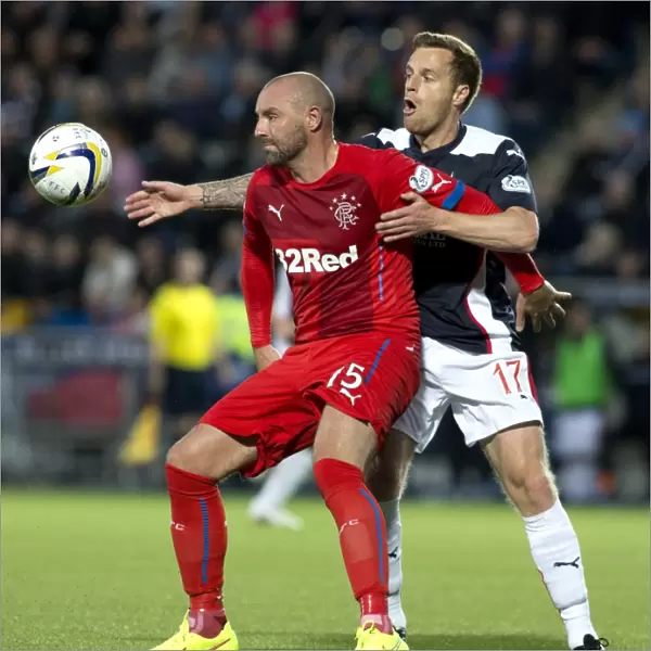 Clash on the Pitch: Rangers Kris Boyd vs Falkirk's Alan Maybury - A Battle for Supremacy in the SPFL Championship