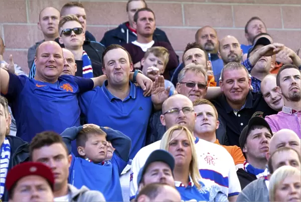 A Sea of Passion: Hibernian vs Rangers - Unwavering Support of Rangers FC Fans in the Petrofac Training Cup