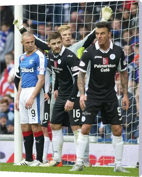Kyle Hutton of Queen of the South Faces Off Against Rangers at Ibrox Stadium