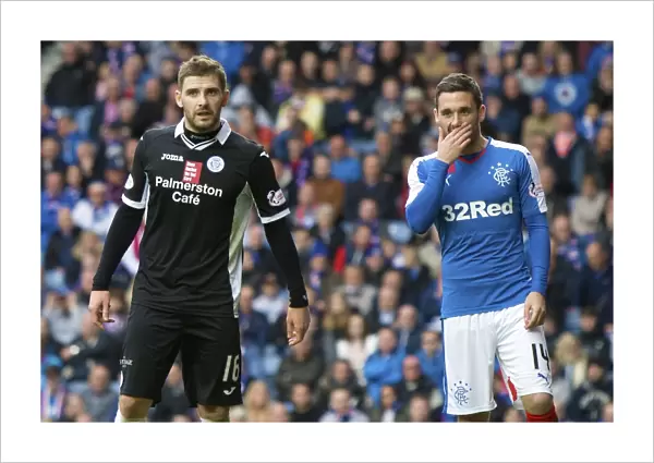Intense Moment: A Heart-to-Heart Between Kyle Hutton and Nicky Clark at Ibrox Stadium during Rangers vs Queen of the South