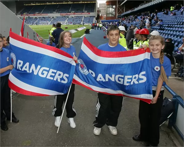 Rangers Flag Bearers Celebrate 2-0 Victory Over Heart of Midlothian