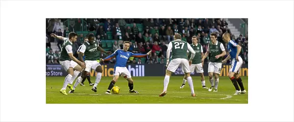 Intense Rivalry: Barrie McKay's Battle for the Ball in Rangers vs Hibernian's Championship Clash at Easter Road