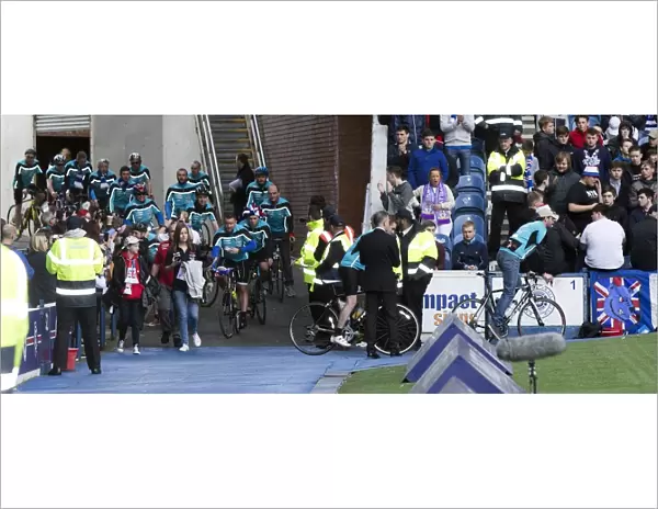 Charity Cyclists In Action Amidst the Ladbrokes Championship Match at Ibrox Stadium