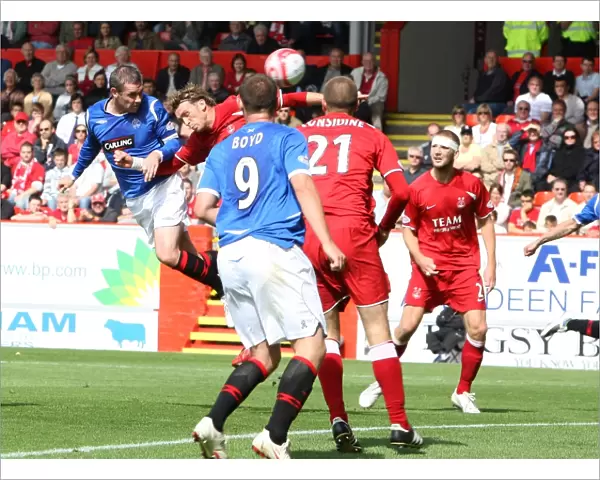 David Weir Scores the Opener: Aberdeen vs Rangers, Premier League Soccer Match at Pittodrie (1-1)