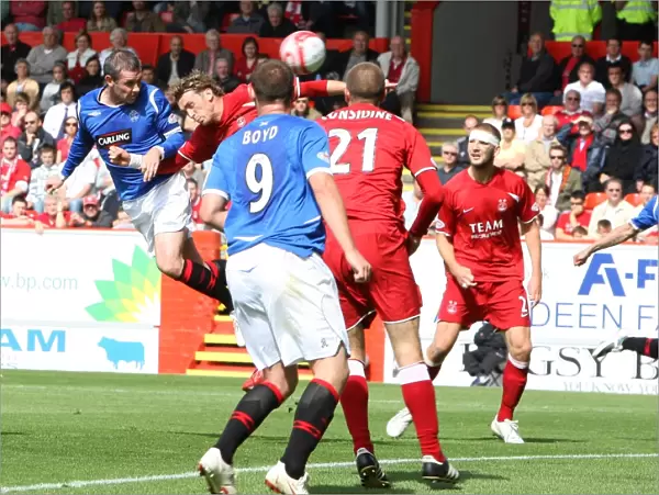 David Weir Scores the Opener: Aberdeen vs Rangers, Premier League Soccer Match at Pittodrie (1-1)