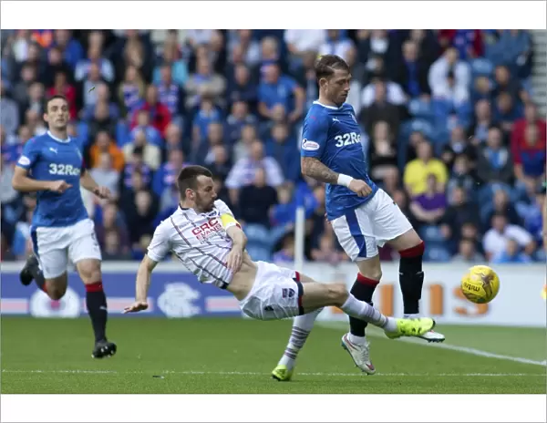 Rangers vs Ross County: Joe Garner vs Paul Quinn - Intense Moment in the Ladbrokes Premiership at Ibrox Stadium