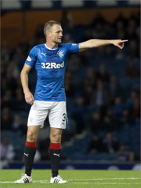 Clint Hill in Betfred Cup Quarterfinal Action: Rangers vs Queen of the South at Ibrox Stadium