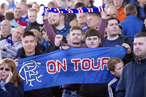 A Sea of Passion: Rangers Fans Celebrate Scottish Cup Victory at Pittodrie Stadium