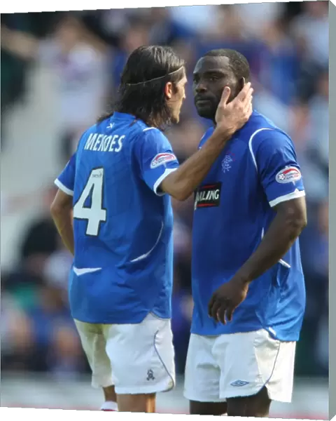 Rangers Pedro Mendes and Jean-Claude Darchville: Celebrating a 3-0 Victory Over Hibernian in the Clydesdale Bank Premier League