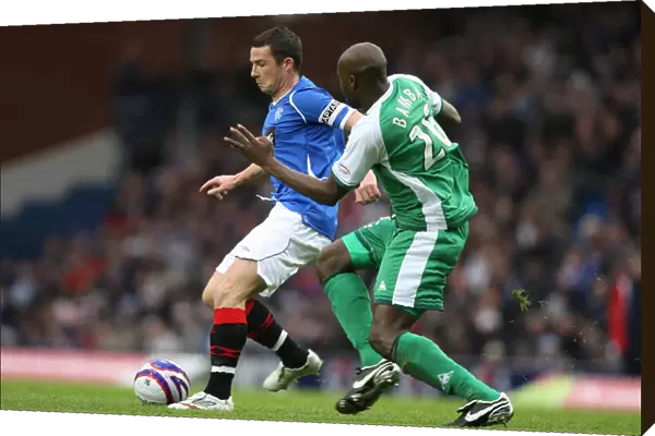 Intense Rivalry: Bamba vs Ferguson's Battle for the Ball (Rangers 1-0 Hibernian)
