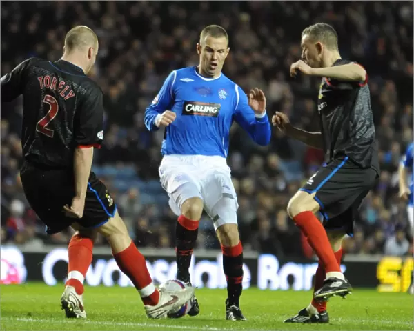A Pivotal Moment: Kenny Miller vs Ross Tokley in the Clydesdale Bank Premier League Clash at Ibrox (1-0 in Favor of Inverness)
