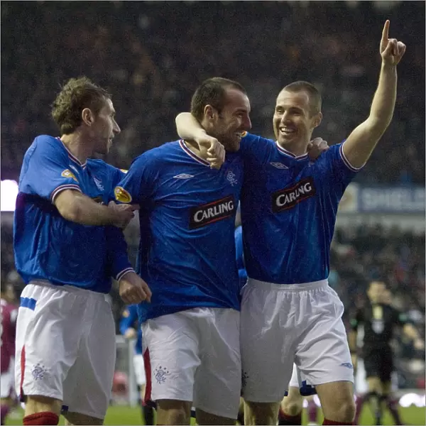 Rangers Triumph: Kris Boyd, Kenny Miller, and Kirk Broadfoot's Celebration after 3-0 Victory over St. Johnstone at Ibrox
