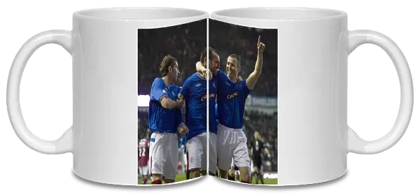 Rangers Triumph: Kris Boyd, Kenny Miller, and Kirk Broadfoot's Celebration after 3-0 Victory over St. Johnstone at Ibrox