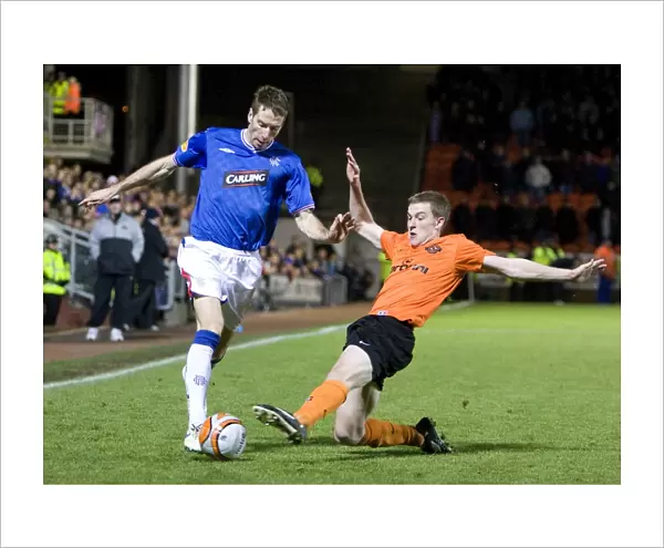 Rangers Kirk Broadfoot Tackled by Dundee United's Scott Robertson: Clydesdale Bank Premier League's 3-0 Thriller