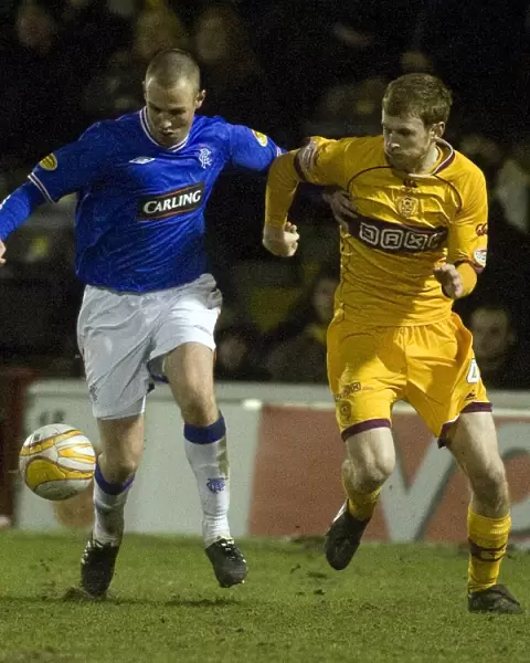 Intense Rivalry: Kenny Miller vs Mark Reynolds in the Motherwell vs Rangers Clydesdale Bank Scottish Premier League Match (1-1)