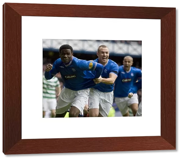 Euphoria Unleashed: Maurice Edu and Kenny Miller's Game-Winning Goal Celebration (Rangers 1-0 Celtic, Clydesdale Bank Premier League, Ibrox)