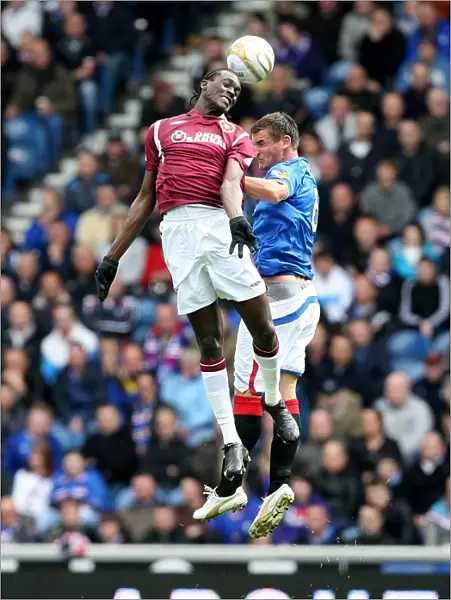 Intense Aerial Clash: McCulloch vs Obua - Rangers 2-0 Victory Over Heart of Midlothian