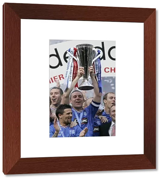 Rangers Football Club: David Weir's Triumphant Lift of the SPL Trophy at Ibrox Stadium