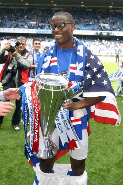 Maurice Edu Celebrates SPL Championship Win with Rangers Football Club at Ibrox Stadium