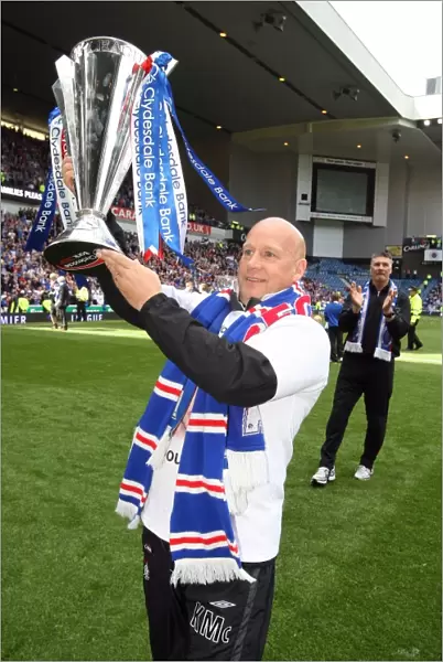 Rangers Football Club: SPL Champions 2023 - Kenny McDowall's Triumphant Moment with the Trophy at Ibrox Stadium