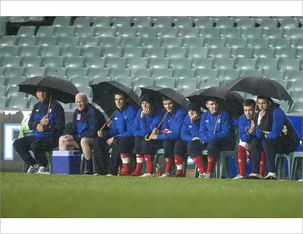 Rangers FC Weathering the Storm: Huddled Under Umbrellas at Sydney Football Stadium during Sydney Festival of Football 2010