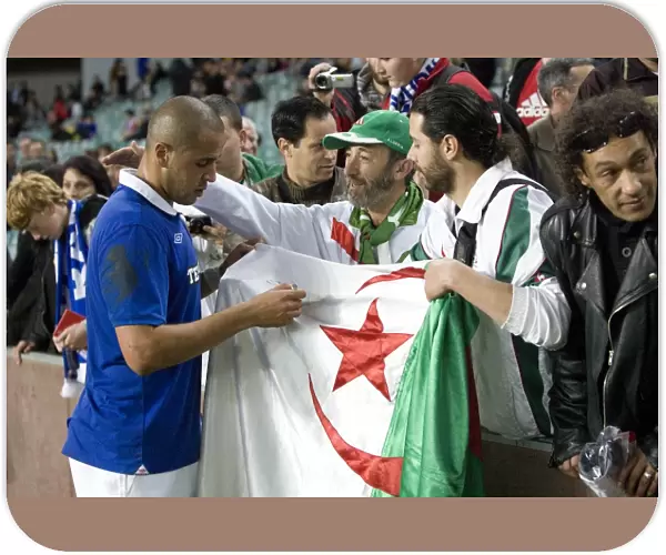 Rangers Bougherra Signs Algerian Flag after AEK Athens Clash at Sydney Football Stadium (Sydney Festival of Football 2010)