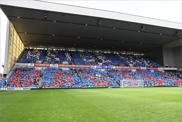 Excited Rangers Fans Celebrate 2-1 Lead Over Kilmarnock in Ibrox Stadium