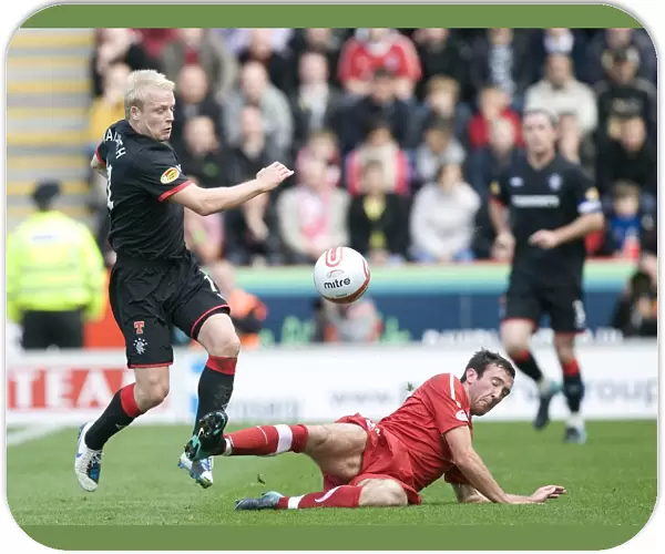 Naismith vs Vernon: A Clash at Pittodrie - Rangers 2-3 Victory