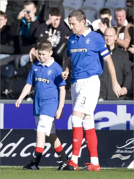 Rangers Triumph: David Weir and the Mascot: Celebrating a 3-1 Victory over St. Mirren in the Scottish Premier League