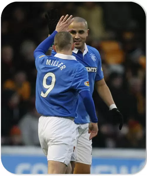 Rangers Kenny Miller and Madjid Bougherra: Celebrating Miller's Goal in Motherwell's 1-4 Defeat (Clydesdale Bank Scottish Premier League)