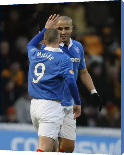 Rangers Kenny Miller and Madjid Bougherra: Celebrating Miller's Goal in Motherwell's 1-4 Defeat (Clydesdale Bank Scottish Premier League)