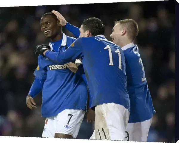 Rangers Football Club: Maurice Edu, Kyle Lafferty, and Gregg Wylde's Triumphant Celebration after Rangers 4-0 Victory over Hamilton (Clydesdale Bank Premier League)