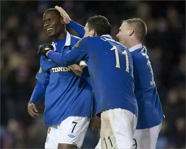 Rangers Football Club: Maurice Edu, Kyle Lafferty, and Gregg Wylde's Triumphant Celebration after Rangers 4-0 Victory over Hamilton (Clydesdale Bank Premier League)