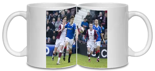 Rangers Jamies Ness Defends Against Hearts Ruben Palazuelos in 1-0 Clydesdale Bank Scottish Premier League Thriller at Tynecastle