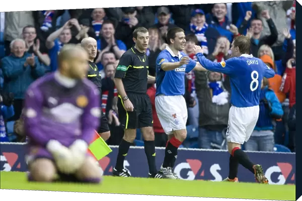 Rangers David Healy and Steven Davis: A Celebratory Moment in Rangers 6-0 Victory over Motherwell at Ibrox Stadium (Scottish Premier League)