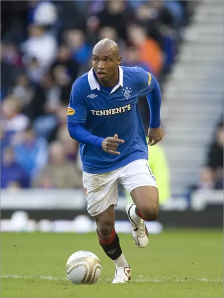 El Hadji Diouf's Brace Leads Rangers to Dominant 6-0 Victory over Motherwell at Ibrox