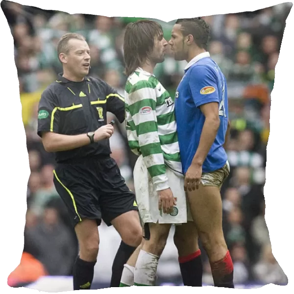 Clash at Celtic Park: Kyle Bartley vs. Georgios Samaras - Rangers Intense Moment Amidst Celtic's 3-0 Victory