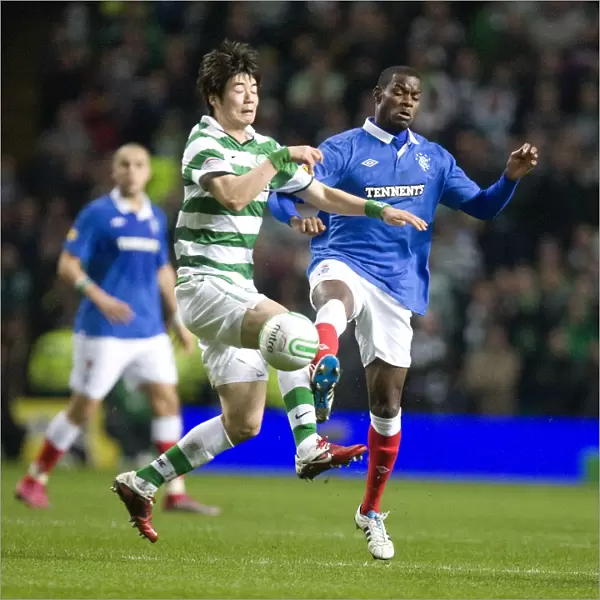 Maurice Edu vs Ki Sung Yueng: A Clash of Midfield Titans in the Scottish Cup Fifth Round Replay: Celtic 1-0 Rangers