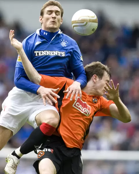 Thrilling Comeback: Jelavic and Douglas Star in 2-3 Victory for Dundee United at Ibrox Stadium