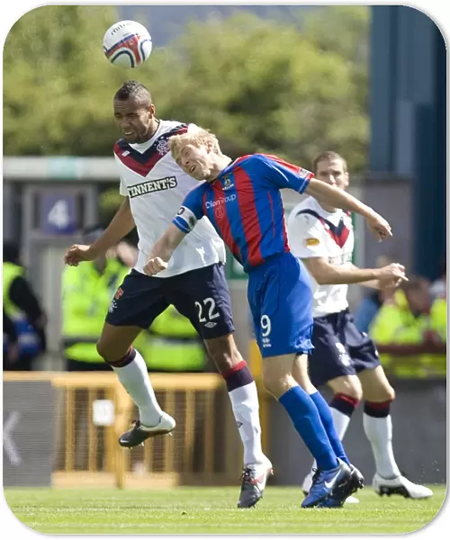 Rangers Kyle Bartley and Richie Foran Clash in Intense Clydesdale Bank Scottish Premier League Match: Inverness Caledonian Thistle vs Rangers (2-0)