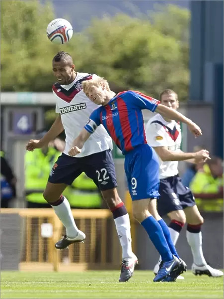 Rangers Kyle Bartley and Richie Foran Clash in Intense Clydesdale Bank Scottish Premier League Match: Inverness Caledonian Thistle vs Rangers (2-0)