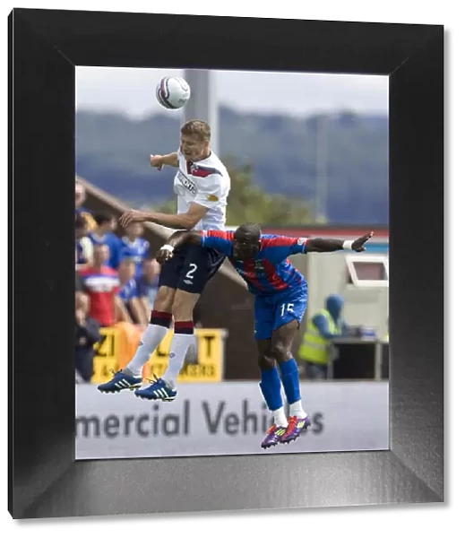 Rangers Dorin Goian and Gregory Tade Clash in CPL: Inverness Caledonian Thistle vs Rangers (2-0)