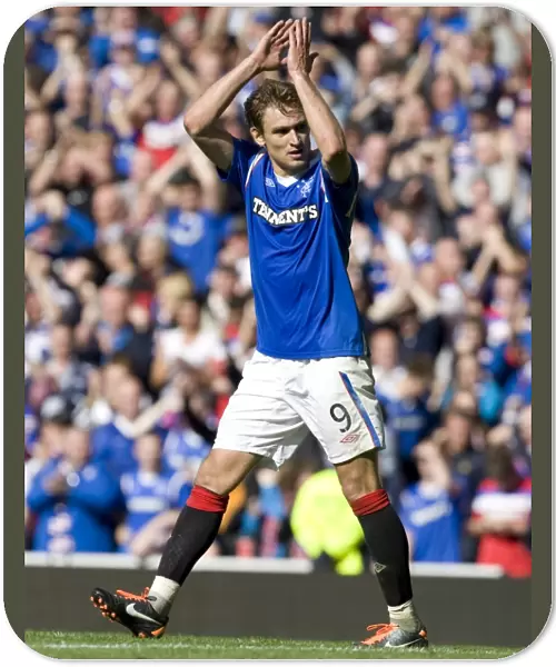 Rangers Nikica Jelavic Celebrates with Fans: A Triumphant Moment in the 4-2 Victory over Celtic at Ibrox Stadium