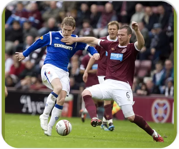 Rangers Steven Davis vs Hearts Andy Webster: A Rivalry Unfolds in the Clydesdale Bank Scottish Premier League at Tynecastle Stadium - Rangers Lead 2-0