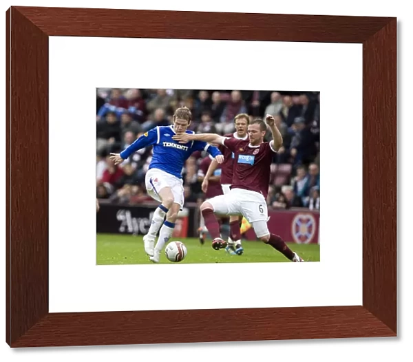 Rangers Steven Davis vs Hearts Andy Webster: A Rivalry Unfolds in the Clydesdale Bank Scottish Premier League at Tynecastle Stadium - Rangers Lead 2-0