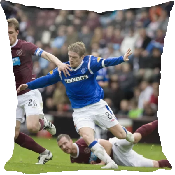 Steven Davis vs Marius Zaliukas: Intense Clash between Rangers and Heart of Midlothian in Scottish Premier League