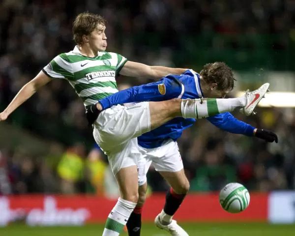 Jelavic vs Rogne: Intense Moment in Celtic vs Rangers Football Match (1-0)